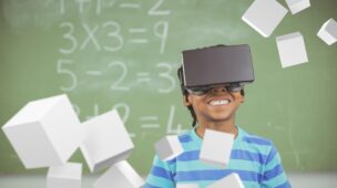 Garoto em aula com óculos de realidade virtual